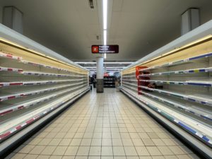 A photograph of empty Sainsbury's supermarket shelves